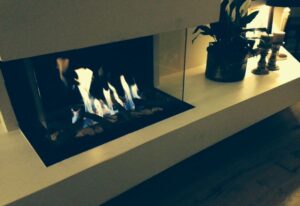 Ortal fireplace with roaring fire in Washington, DC