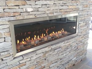 Large scaled outdoor gas fireplace with flames in Washington, DC